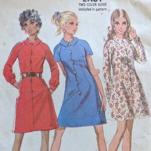 May include: A sewing pattern for a dress in three versions. The pattern is for misses' sizes 12-34 and includes a two-colour guide. The dress is shown in red, blue, and floral print.