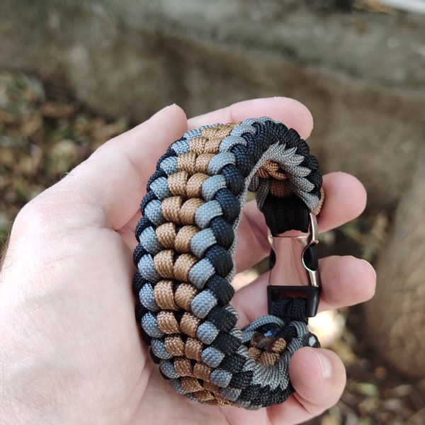 grey, black and bronze paracord bracelet