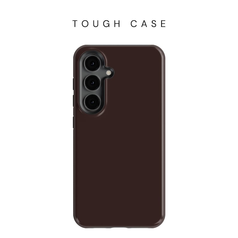 May include: A dark brown phone case with a camera lens cutout. The case is designed to protect a phone from damage.