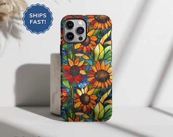 May include: A phone case with a stained-glass sunflower design. The case features a vibrant pattern of yellow, orange, and red sunflowers with green leaves against a blue background. The word "TOUGH" is printed at the bottom.