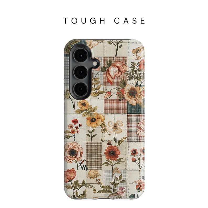 May include: A phone case with a floral pattern on a white background. The case has a patchwork design with squares of different colors and patterns. The flowers are in shades of pink, yellow, and orange.