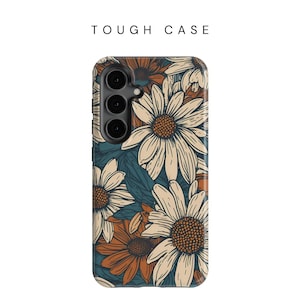 May include: A tough phone case with a floral design featuring white and orange daisies on a teal background. The case has a cutout for the camera lens.