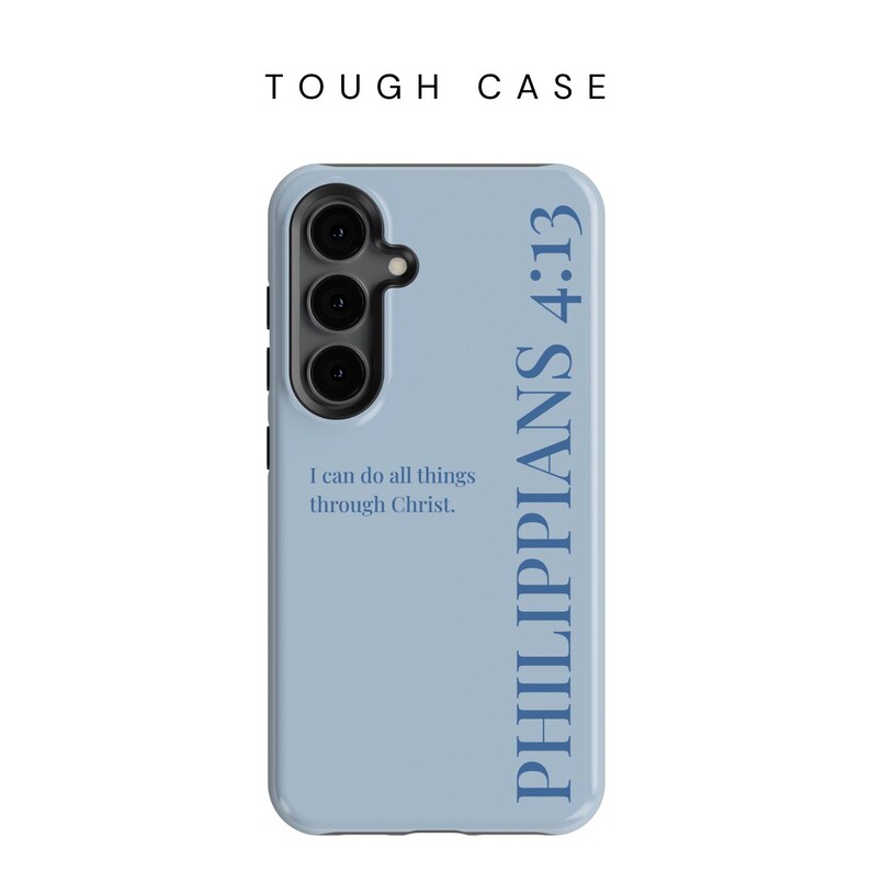 May include: A light blue phone case with the text "TOUGH CASE" at the top. The case features a camera cutout and the words "PHILIPPIANS 4:13" in blue. Below the camera, it reads "I can do all things through Christ."
