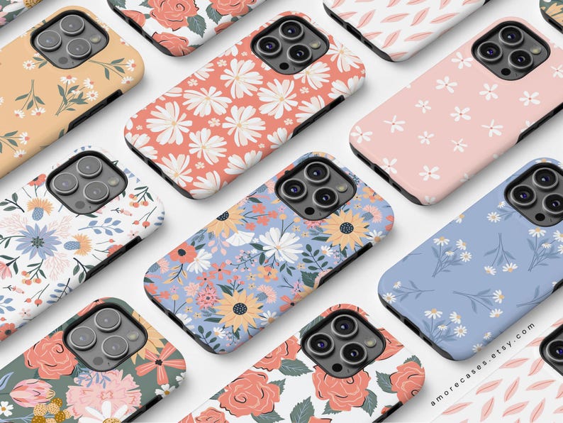 May include: A collection of phone cases featuring various floral patterns. The cases are designed for a smartphone with a camera bump. The patterns include pink and white flowers, blue and white flowers, red and white roses, and more. The cases are all made of a durable material and are designed to protect your phone from scratches and drops.