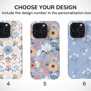 May include: Three iPhone cases with different floral designs. The first case has a white background with a colorful floral pattern. The second case has a light blue background with a colorful floral pattern. The third case has a light blue background with a white daisy pattern. The cases are numbered 4, 5, and 6.
