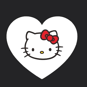 May include: A white heart shape with a cartoon image of Hello Kitty inside. Hello Kitty has a red bow, black whiskers, and a yellow nose. The background is solid black.