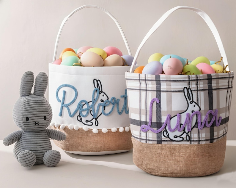 two Easter baskets, each with a stuffed bunny toy and decorated with the names "Robert" and "Luna" embroidered on them.