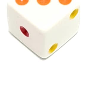 May include: White dice with three orange dots and two yellow dots on the top face and one red dot on the side face.