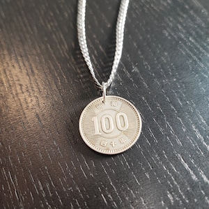 Silver pendant coin Japan 100 yen 50 cm stainless steel chain. 835 silver!