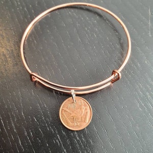 Bangle coin Cayman Islands 1 cent real coin bird