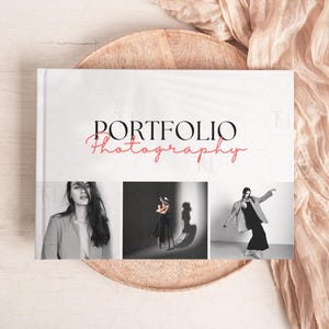 May include: A white book with the text "PORTFOLIO Photography" in black and red. The book cover features three black and white photographs of models.