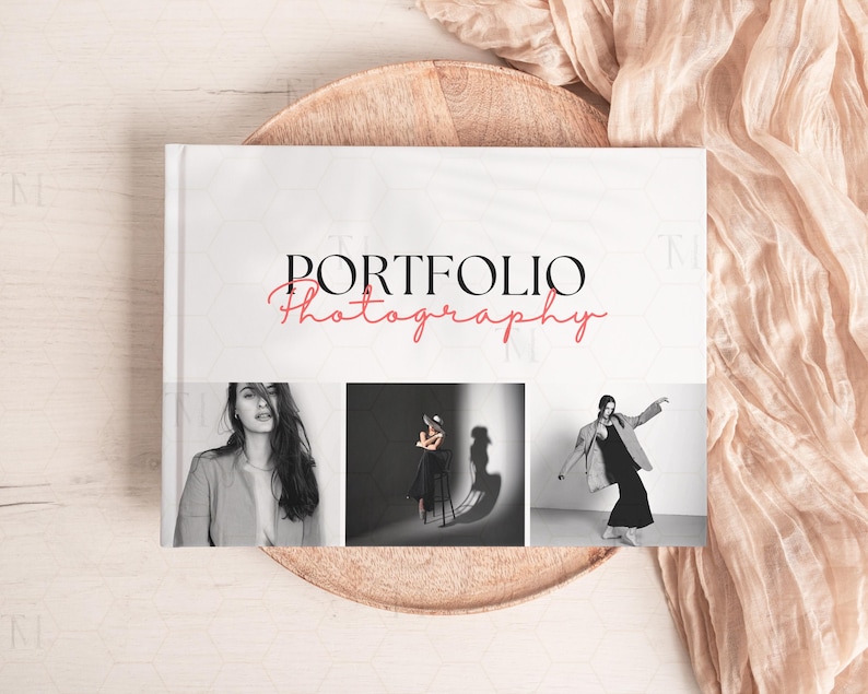 May include: A white book with the text "PORTFOLIO Photography" in black and red. The book cover features three black and white photographs of models.