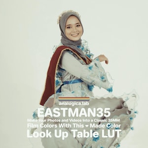 May include: A woman in a grey headscarf and a light-coloured dress with blue floral details and a red shawl. The image includes the text "EASTMAN35" and "Look Up Table LUT".