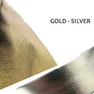 May include: Two pieces of leather, one gold and one silver, with a textured surface. The text "GOLD - SILVER" is printed on the image.