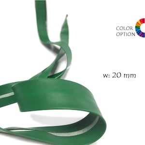 May include: Green zipper tape with a white stripe down the center. The tape is 20 mm wide.  w: 20 mm