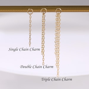 May include: Three gold-coloured chain charms, each with a different design. The first charm is a single chain, the second is a double chain, and the third is a triple chain. Text on the image reads "Single Chain Charm", "Double Chain Charm", and "Triple Chain Charm".