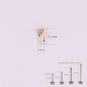 May include: Gold dangle earring with a geometric design, measuring 11.1 mm in length and 4.6 mm in width. The earring comes with a flat push back in four sizes: 5 mm, 6 mm, 8 mm, and 10 mm.