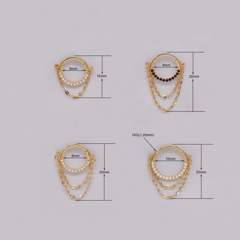 May include: Four gold hoop earrings with dangling chains. The hoops are 8mm and 10mm in diameter. The chains are adorned with small clear or black gemstones. The earrings are 15mm or 20mm long.