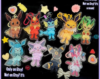 Eeveelution swinging charm keychains CooperButterStuff Sylveon Umbreon Eevee vaporeon