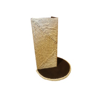 May include: A brown and beige cat scratching post with a round base. The post is covered in sisal rope and has a textured surface.