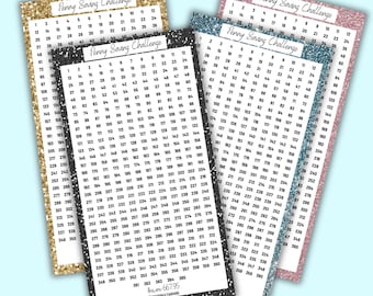 May include: Four colorful Penny Saving Challenge charts with glittery borders. Each chart has a grid of numbers for tracking savings, with the text "Penny Saving Challenge" at the top.