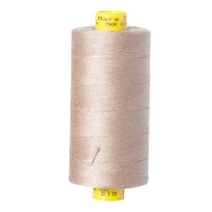 May include: A spool of beige thread with a yellow label that reads "Mara 70" and "Made in Italy".