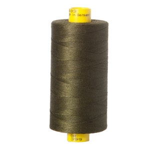 May include: A spool of dark green thread with a yellow label that reads "Col. 399" and "Made in Germany".