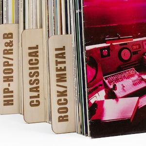 May include: A selection of vinyl records, categorised with wooden dividers marked "HIP-HOP/R&B", "CLASSICAL", and "ROCK/METAL". The right side shows a red-toned album cover with a sound mixing console.