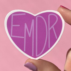 May include: Purple heart-shaped sticker with the text "EMDR" in white lettering.