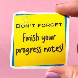 May include: Yellow sticky note with the text "DON'T FORGET Finish your progress notes!" on it. A silver paper clip is attached to the top of the note.