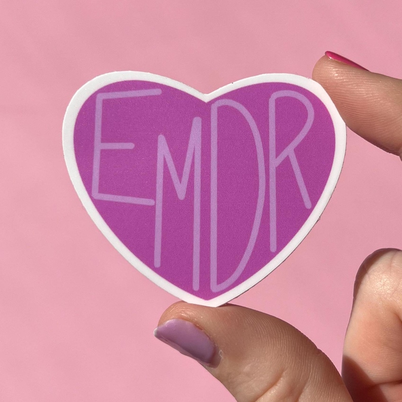 May include: Purple heart-shaped sticker with the text "EMDR" in white lettering.