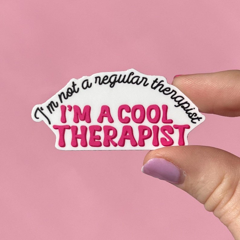 May include: White sticker with pink text that reads "I'm not a regular therapist I'M A COOL THERAPIST".