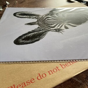 May include: A black and white zebra print illustration of a zebra's head and neck. The zebra is looking to the right of the image. The illustration is on a white background.