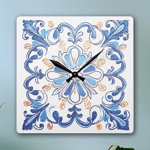May include: Square wall clock with a blue and white patterned design. The clock face is white with black hands and a black center.