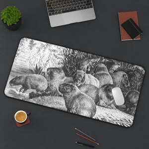 May include: Black and white illustration of a group of capybaras in a jungle setting. The capybaras are depicted in a variety of poses, some standing, some sitting, and some lying down. The illustration is detailed and realistic, with intricate details of the animals' fur and the surrounding foliage.