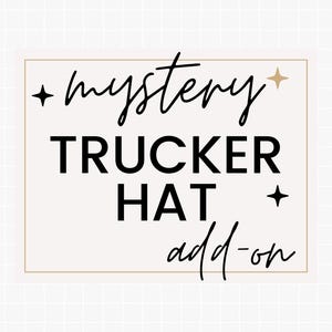 May include: A beige rectangular graphic with the words "mystery TRUCKER HAT add-on" in black and script font. The words are centered within a gold-lined rectangle. Black star and gold star accents are included.