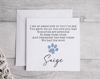 May include: A white card with a blue paw print and the text "I am at peace now so don't be sad You gave me all the love you had Memories are precious So keep them close And remember the best times We had the most Saige"