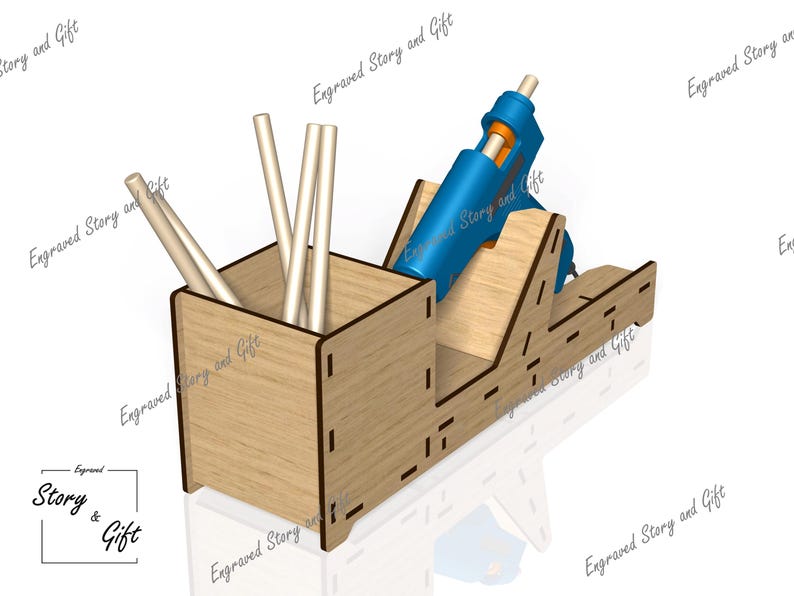 K&ouml;nnte beinhalten: Ein Holzorganizer mit einem Fach f&uuml;r Klebesticks und einem Halter f&uuml;r eine blaue Hei&szlig;klebepistole. Der Organizer ist aus Holz und hat eine nat&uuml;rliche Oberfl&auml;che.