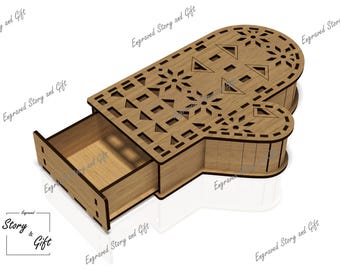 May include: A wooden box shaped like a mitten with a drawer that slides open. The box is decorated with a snowflake pattern.
