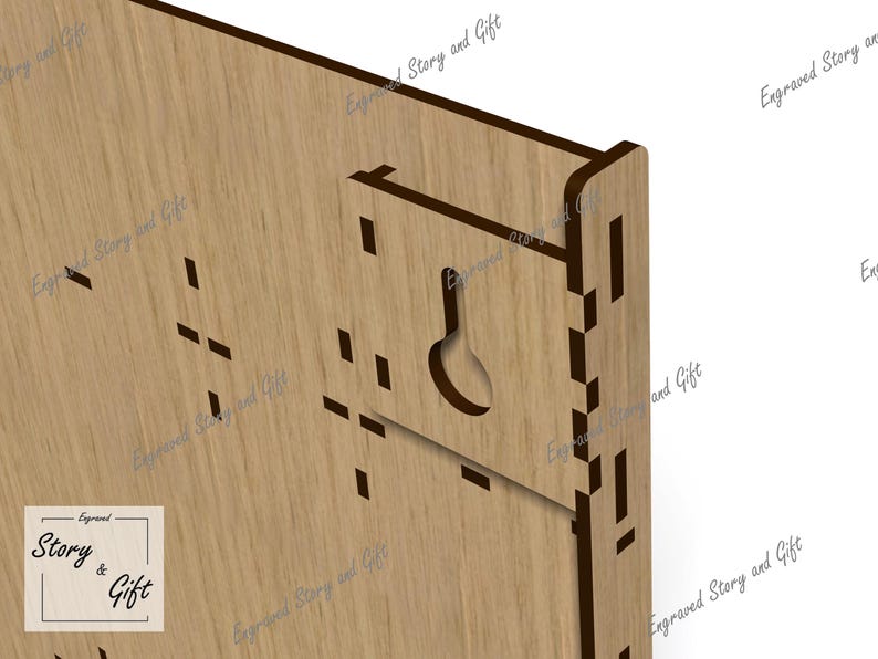 May include: Close-up of a wooden wall hanging with a keyhole-shaped cutout for hanging. The piece is made of light-colored wood with a dark brown border and the text "Story & Gift".