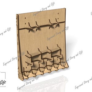 May include: A wooden display stand with multiple shelves and hooks. The stand is made of light brown wood and features the text "Engraved Story and Gift". The design includes slots and cutouts for holding items.