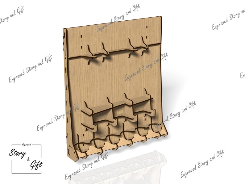 May include: A wooden display stand with multiple shelves and hooks. The stand is made of light brown wood and features the text "Engraved Story and Gift". The design includes slots and cutouts for holding items.