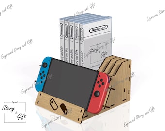 Könnte beinhalten: Halterung aus Holz für Nintendo Switch-Spielekonsole und Spielkassetten. Die Halterung besteht aus hellbraunem Holz und hat Schlitze für Spielkassetten und einen Ständer für die Konsole. Die Konsole hat blaue und rote Controller. Die Spielkassetten befinden sich in weißen Boxen mit dem Nintendo-Logo.