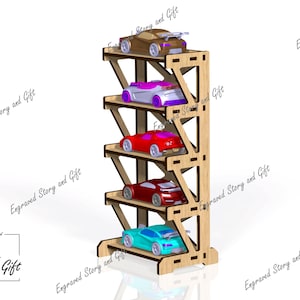 May include: A five-tier wooden display stand featuring a light brown finish with cut-out details. Each level holds a single toy car in various colors including brown, purple, red, dark red, and teal. The text Engraved Story and Gift appears.