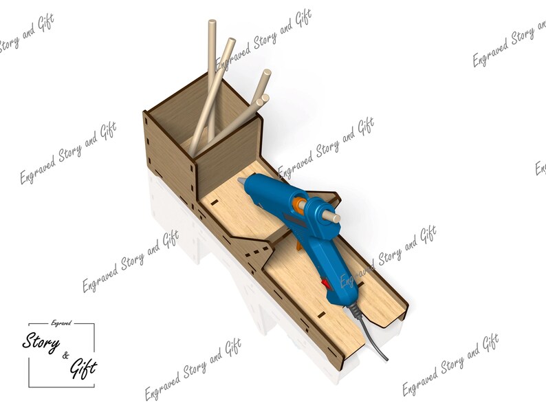 K&ouml;nnte beinhalten: Ein Holzst&auml;nder mit einem Fach zur Aufbewahrung von Klebestiften und einem Schlitz f&uuml;r eine Hei&szlig;klebepistole. Die Hei&szlig;klebepistole ist blau und schwarz und hat ein Kabel.