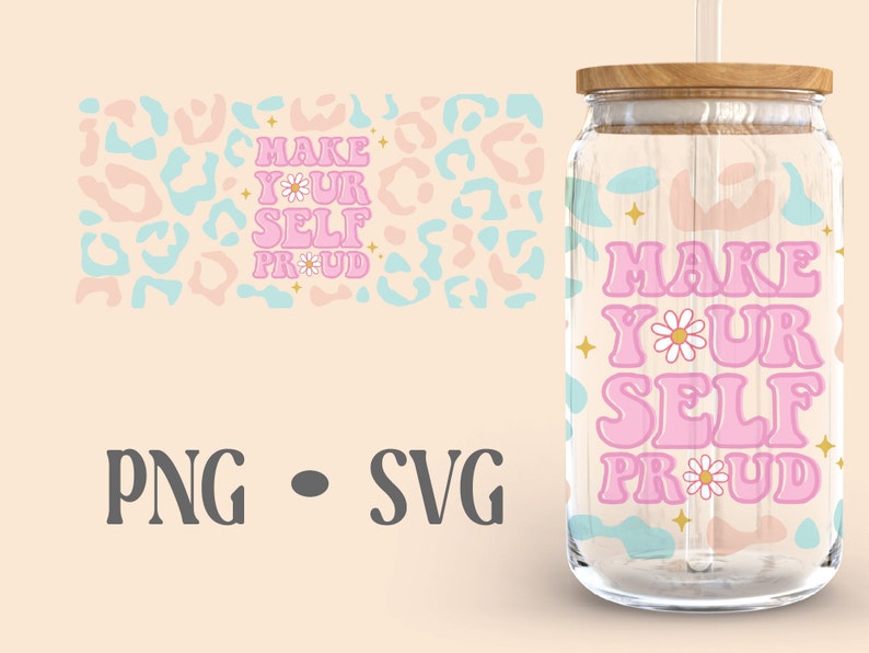 May include: A pink and blue tumbler with the text "MAKE YOUR SELF PROUD" in a retro font. The tumbler has a clear glass body and a wooden lid. There is a straw in the tumbler.