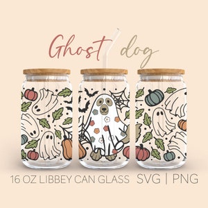 May include: Three 16 oz glass jars with wooden lids and a straw. The jars are decorated with a Halloween theme featuring ghosts, pumpkins, bats, and leaves. The middle jar features a ghost dog with a floral pattern.