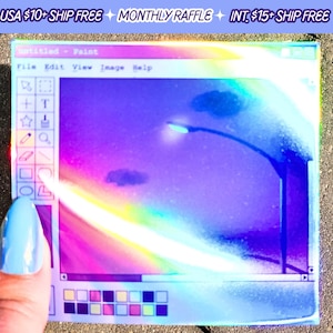 May include: A holographic sticker featuring a retro computer screen with a purple and blue gradient background. The screen displays a blurry image of a streetlight and clouds. The sticker has a white border and the text "untitled - Paint" at the top.
