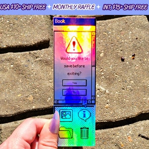 May include: A holographic sticker with a retro computer screen design. The screen says "Book" and has a warning sign with an exclamation point. The text on the screen says "Would you like to save before exiting?" with buttons for "Yes" and "No". Below the screen are icons for a picture, a folder, and a trash can.