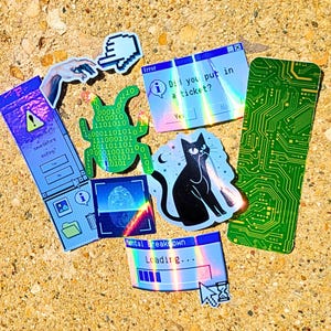 May include: A collection of colorful stickers with a tech theme. Designs include a black cat with a laser beam, a circuit board, and computer error messages. Other stickers feature binary code, a fingerprint, and a hand cursor.